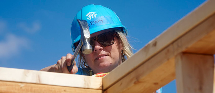 QL_Individual Volunteers Habitat volunteer working on a house construction project
